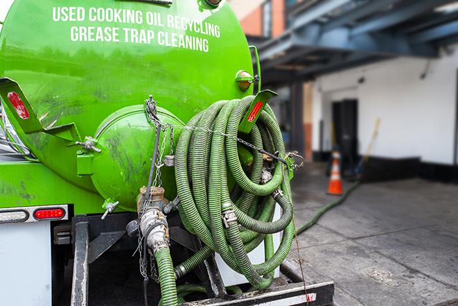 a professional service truck pumping a grease trap in Ashtabula, OH